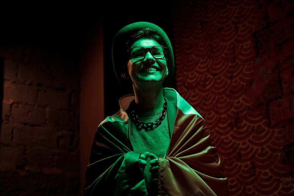 A smiling woman celebrates St. Patrick's Day wrapped in an Irish flag