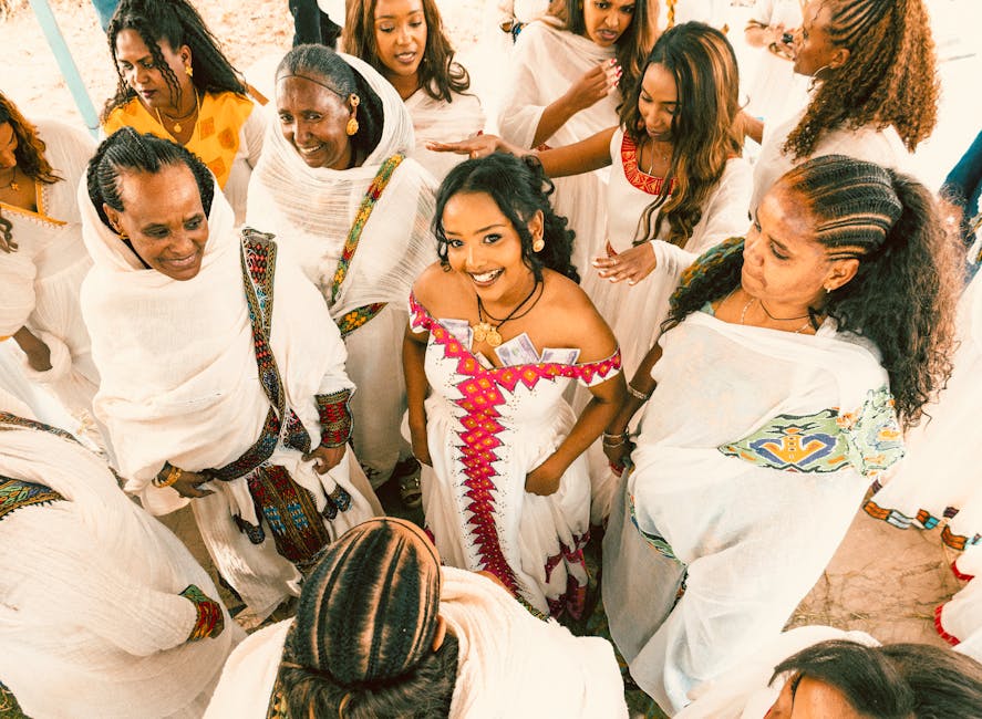 A group of Ethiopian women joyfully celebrating in colorful traditional dresses, showcasing cultural heritage